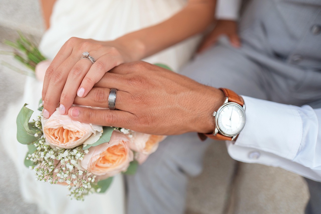 bride and groom holding hands