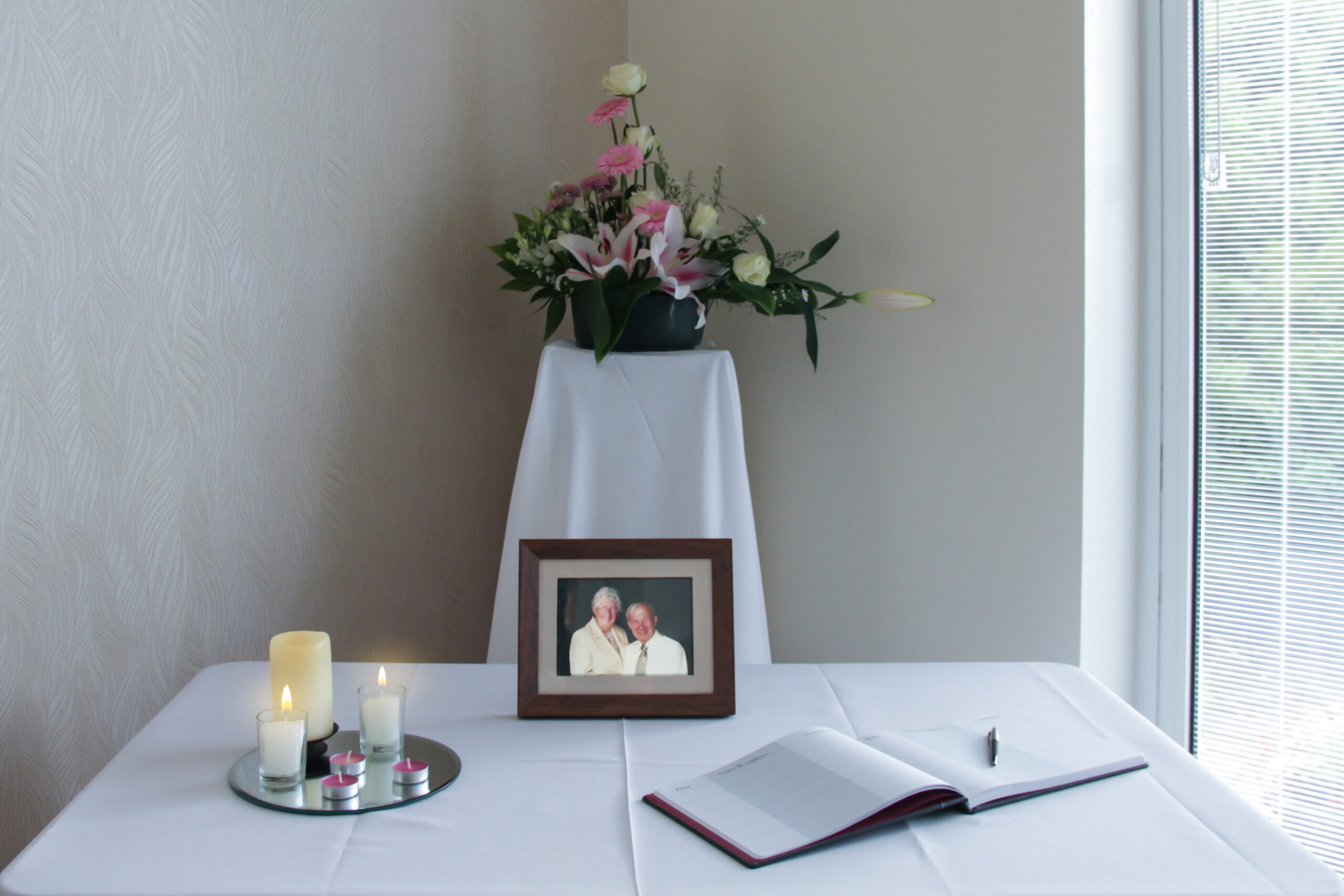 memorial table with candles lit at bowden lodge